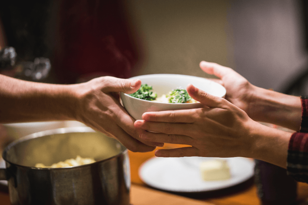 hands sharing food